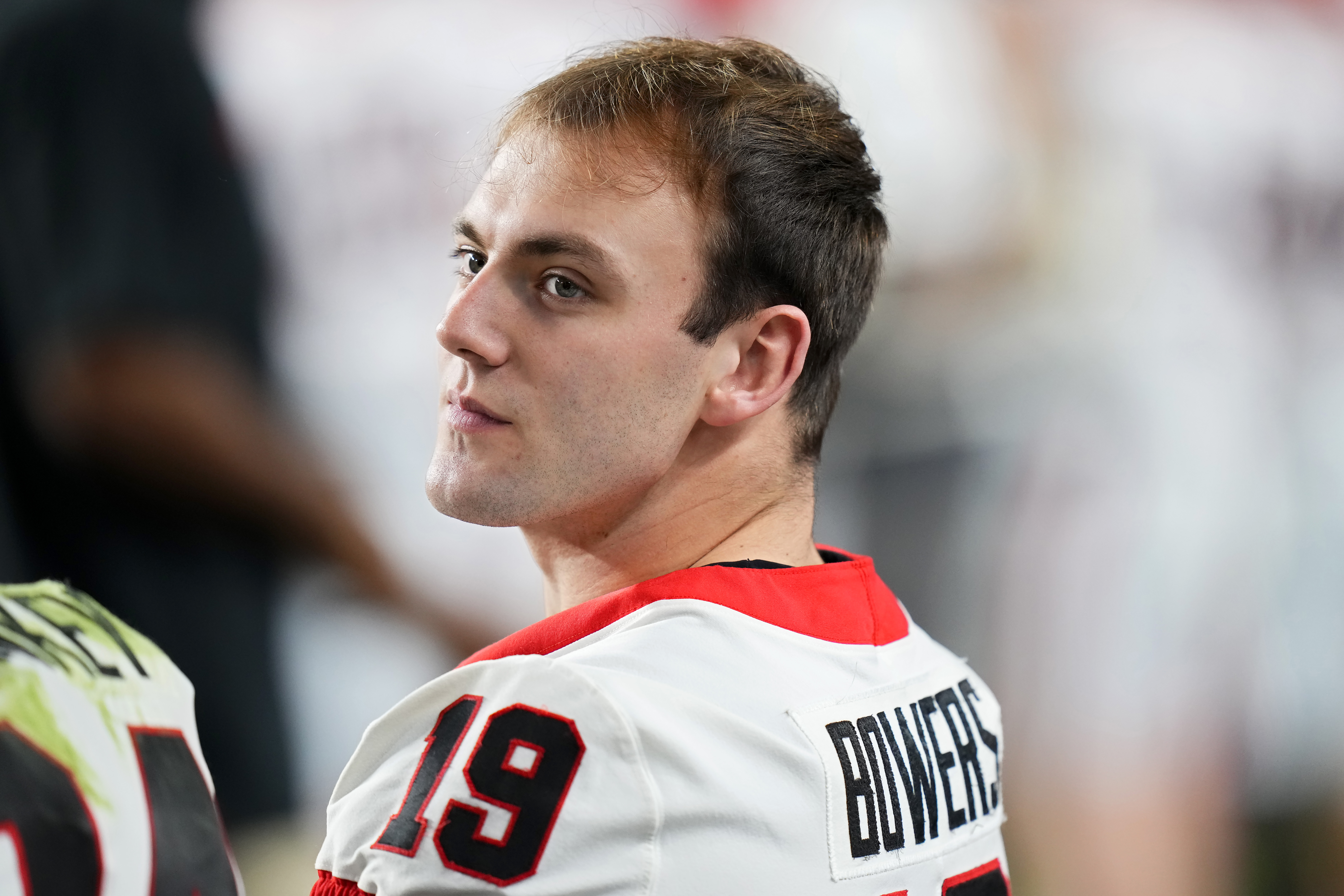 Brock Bowers #19 of the Georgia Bulldogs looks on from the sideline in the third quarter against the Florida State Seminoles during the Capital One Orange Bowl at Hard Rock Stadium on December 30, 2023 in Miami Gardens, Florida.