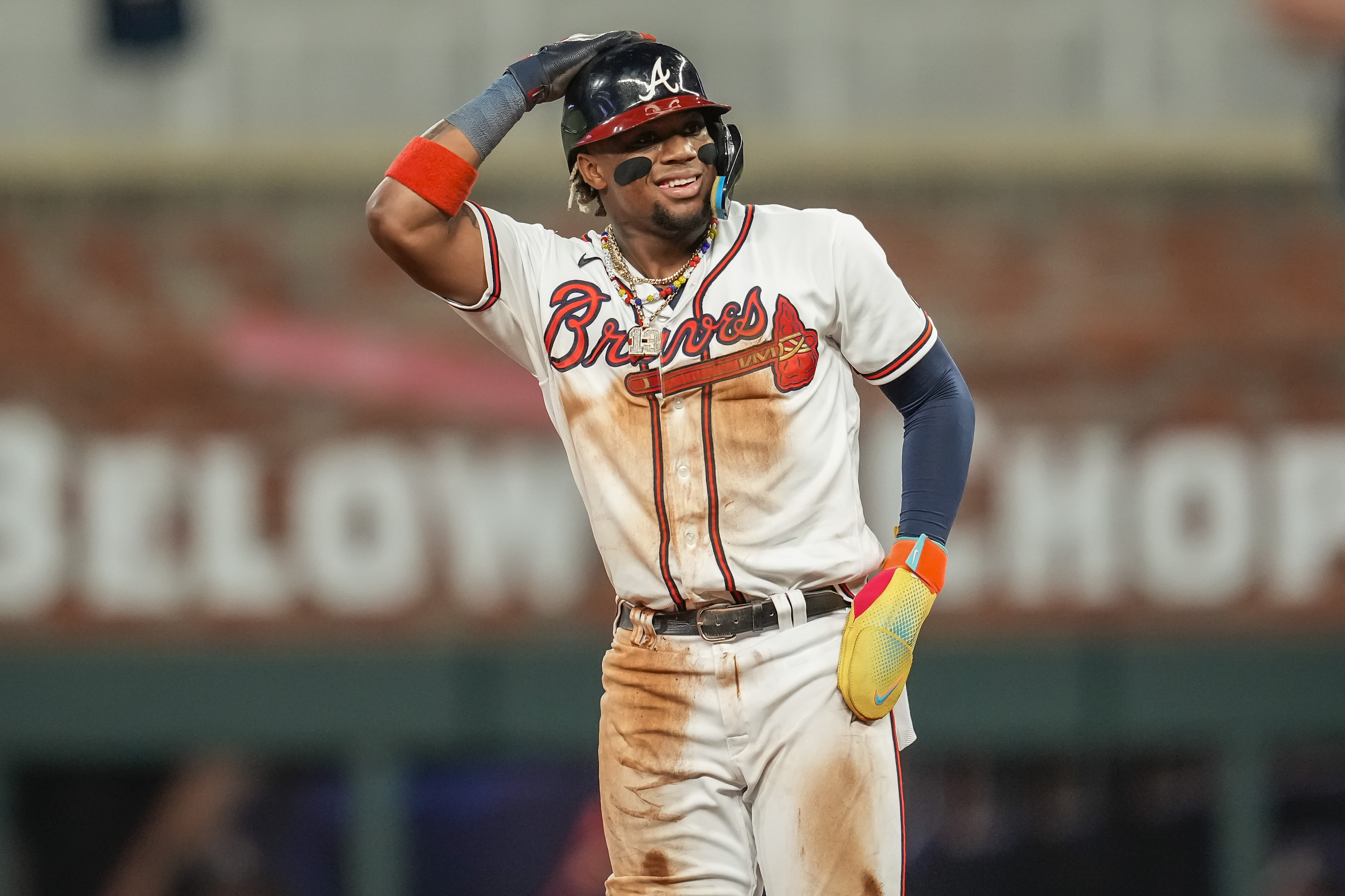 Atlanta Braves right fielder Ronald Acuna Jr. reacts after stealing his 70th base of the season against the Chicago Cubs during the tenth inning at Truist Park.&nbsp;
