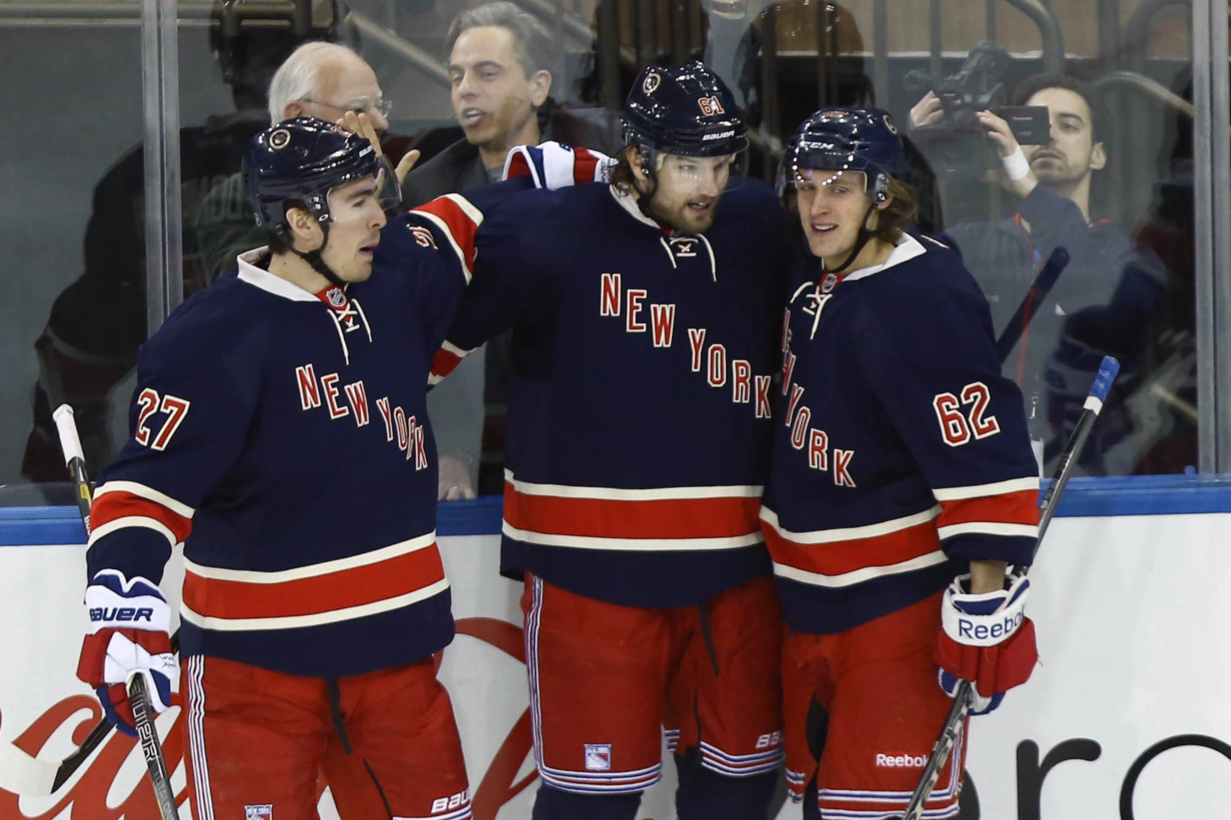 Feb. 10, 2013; New York, NY, USA; New York Rangers left wing Carl Hagelin (62) celebrates with left wing Rick Nash (61) and defenseman Ryan McDonagh (27) after scoring a goal against the Tampa Bay Lightning during the first period at Madison Square G